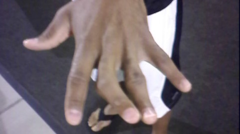 Torry Holt Wears Homage to Old-School Football on His Hand