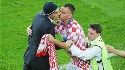 Croatian Fan Runs Onto Field, Kisses Manager Slaven Bilic on Mouth (Video)