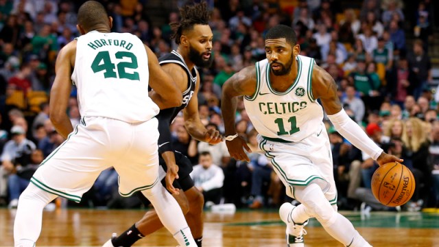 Kyrie Irving drives past Al Horford