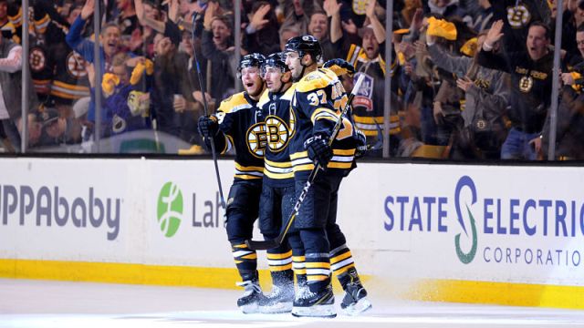 Boston Bruins forwards Brad Marchand and David Pastrnak and center Patrice Bergeron