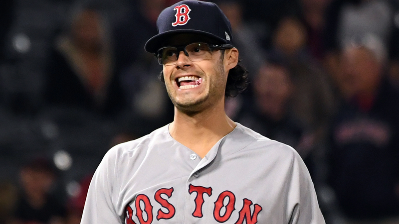 Joe Kelly, suspended Boston Red Sox pitcher, watches from bleachers