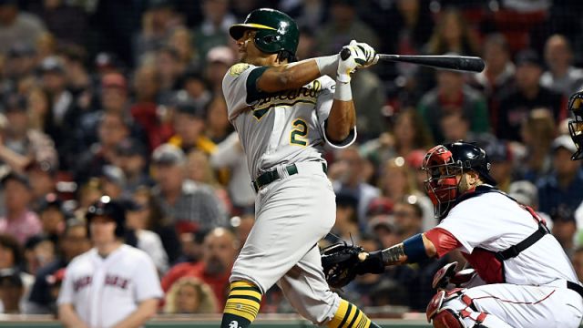 Oakland Athletics designated hitter Khris Davis and Boston Red Sox catcher Sandy Leon