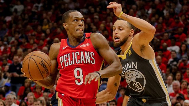 New Orleans Pelicans guard Rajon Rondo and Golden State Warriors guard Steph Curry