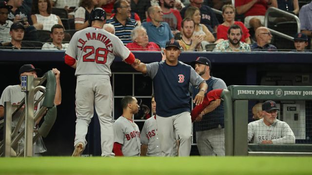 Boston Red Sox designated hitter J.D. Martinez and manager Alex Cora