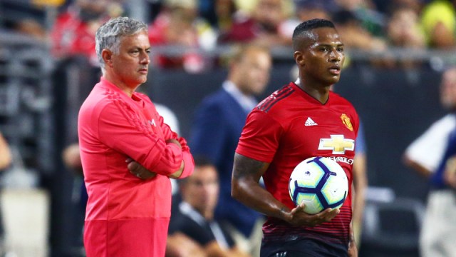 Manchester United manager Jose Mourinho alongside defender Antonio Valencia