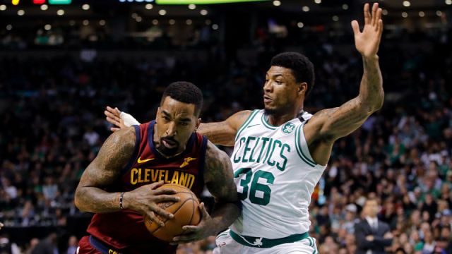 Cleveland Cavaliers guard J.R. Smith and Boston Celtics guard Marcus Smart