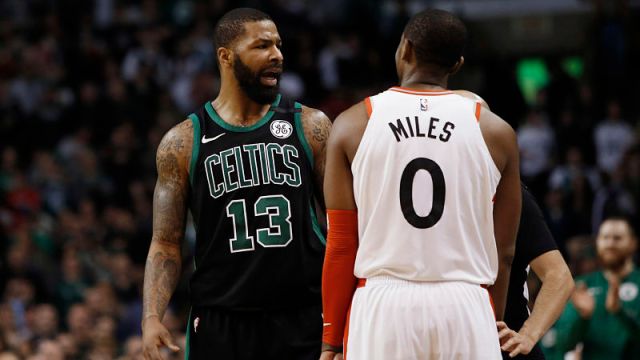 Boston Celtics forward Marcus Morris and Toronto Raptors guard C.J. Miles