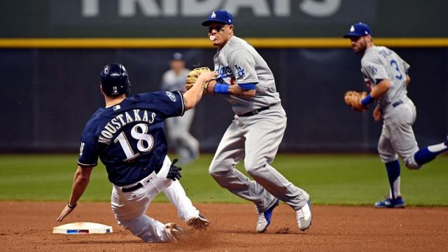 Milwaukee Brewers third baseman Mike Moustakas and Los Angeles Dodgers shortstop Manny Machado