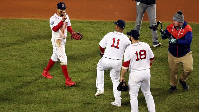Boston Red Sox right fielder Mookie Betts, third baseman Rafael Devers and first baseman Mitch Moreland