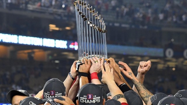Red Sox hoist World Series trophy