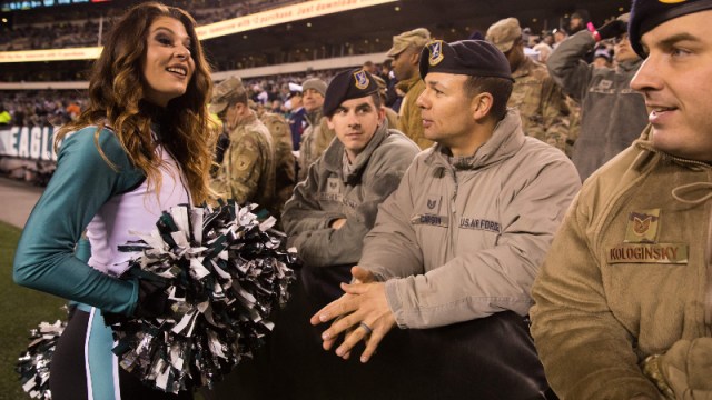 Philadelphia Eagles cheerleader and members of the military