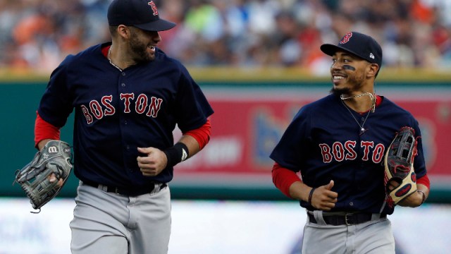 Boston Red Sox outfielders J.D. Martinez (28) and LA Dodgers Outfielder Mookie Betts (50)