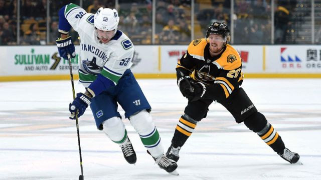 Vancouver Canucks forward Tim Schaller and Boston Bruins forward Joakim Nordstrom
