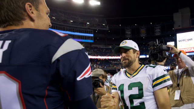 New England Patriots quarterback Tom Brady (12) and Green Bay Packers quarterback Aaron Rodgers (12)