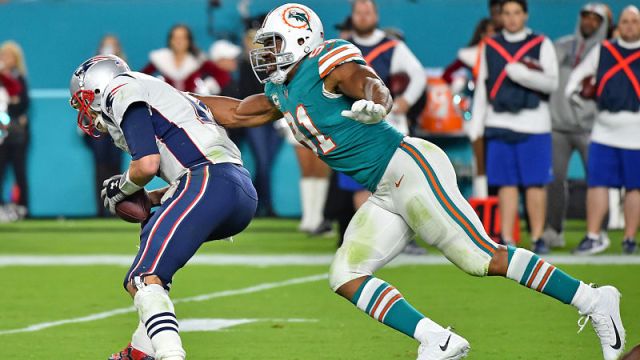 New England Patriots quarterback Tom Brady and Miami Dolphins defensive end Cameron Wake