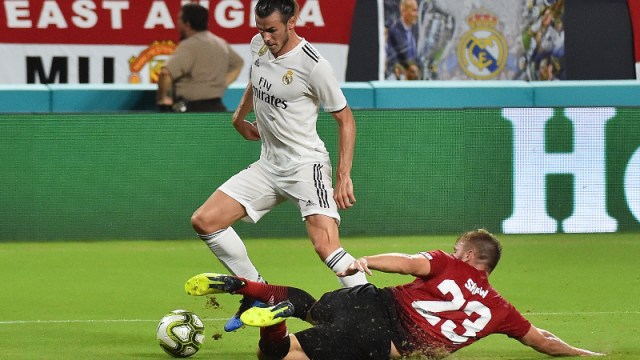Real Madrid forward Gareth Bale (11) and Manchester United defender Luke Shaw