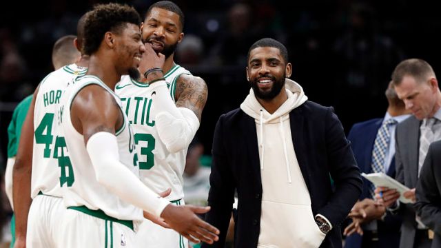 Boston Celtics guards Kyrie Irving and Marcus Smart and forward Marcus Morris