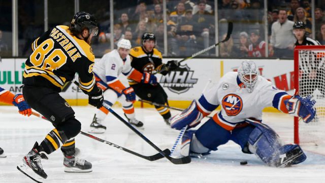 Boston Bruins winger David Pastrnak, New York Islanders goalie Robin Lehner
