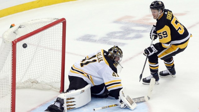 Boston Bruins Goalie Jaroslav Halak And Pittsburgh Penguins Left Wing Jake Guentzel