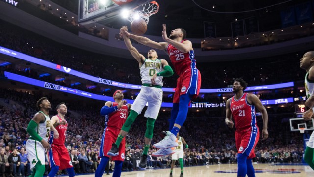 Boston Celtics forward Jayson Tatum (0) and Philadelphia 76ers guard Ben Simmons (25)