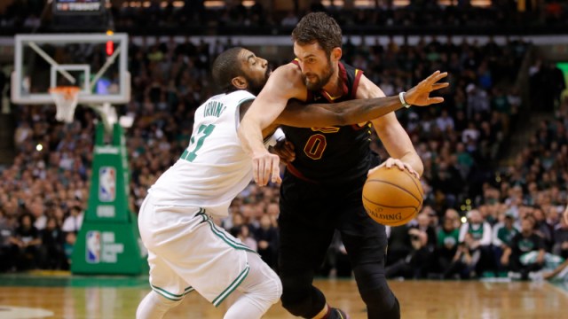 Cleveland Cavaliers forward Kevin Love (0) and Boston Celtics guard Kyrie Irving (11)