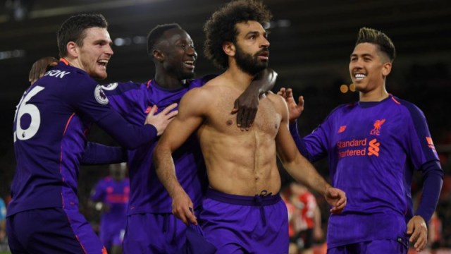 Liverpool's Mohamed Salah (center) and teammates