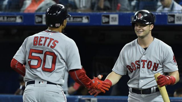 Boston Red Sox outfielders Mookie Betts, Andrew Benintendi