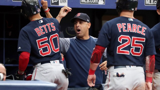 Boston Red Sox right fielder Mookie Betts (50), first baseman Steve Pearce (25) and manager Alex Cora