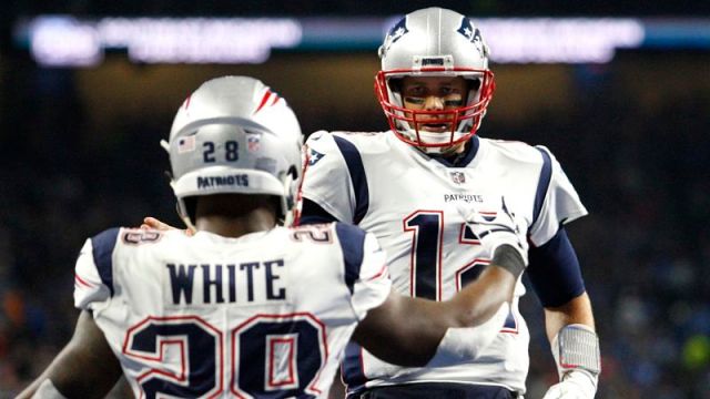 New England Patriots wide receiver James White and quarterback Tom Brady