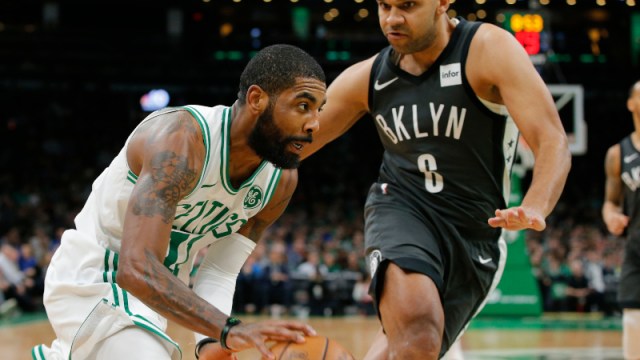 Boston Celtics guard Kyrie Irving (11) and Brooklyn Nets forward Jared Dudley (6)