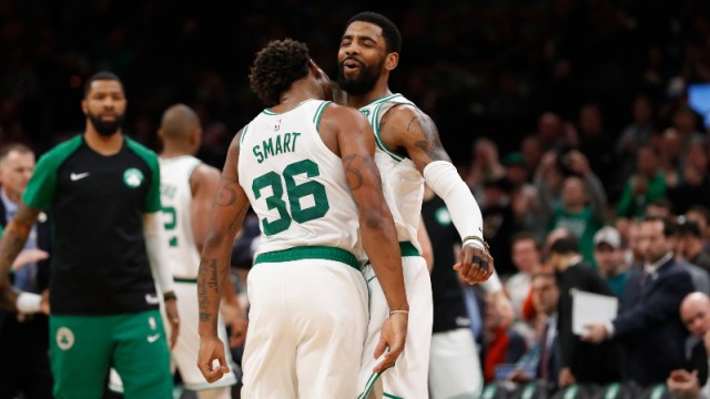 Boston Celtics guards Kyrie Irving (11) and Marcus Smart (36)