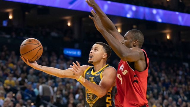 Golden State Warriors guard Stephen Curry and Toronto Raptors forward Serge Ibaka