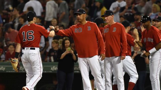 Boston Red Sox left fielder Andrew Benintendi and manager Alex Cora