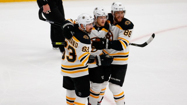 Boston Bruins Torey Krug, David Pastrnak, Brad Marchand