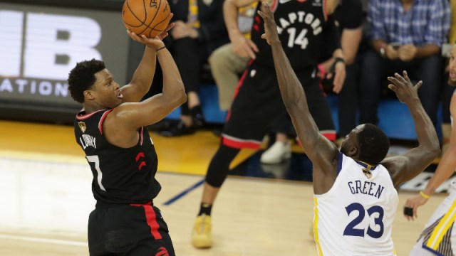 Toronto Raptors guard Kyle Lowry (7) and Golden State Warriors forward Draymond Green (23)