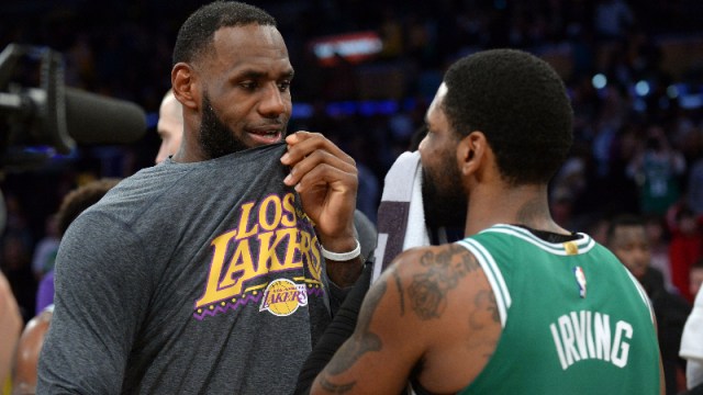 Los Angeles Lakers forward LeBron James (23) and Boston Celtics guard Kyrie Irving (11)