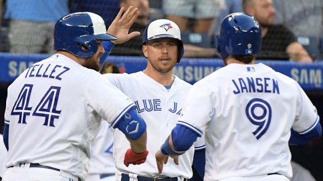Toronto Blue Jays catcher Danny Jansen, third baseman Rowdy Tellez and designated hitter Justin Smoak