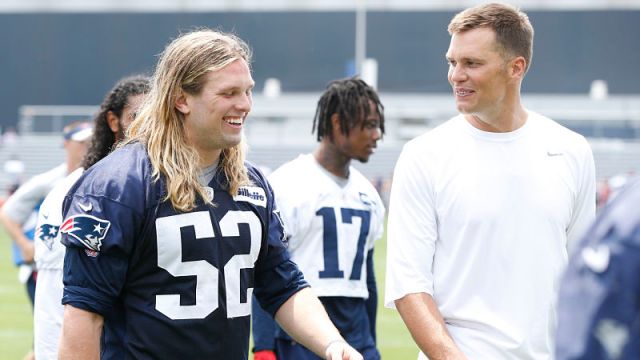 New England Patriots defensive lineman Chase Winovich and quarterback Tom Brady