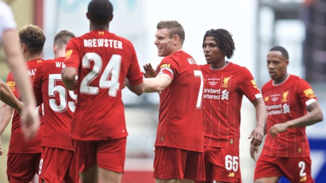 Liverpool striker Rhian Brewster (24), James Milner (7) and teammates