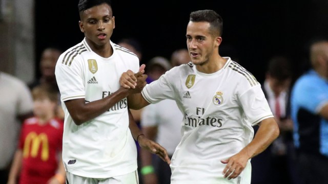 Real Madrid forwards Rodrygo (27) and Lucas Vazquez (17)
