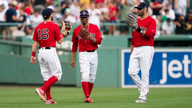 Boston Red Sox outfielders Andrew Benintendi, Mookie Betts and J.D. Martinez