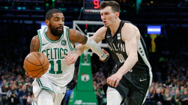Brooklyn Nets guards Kyrie Irving (left) and Rodions Kurucs