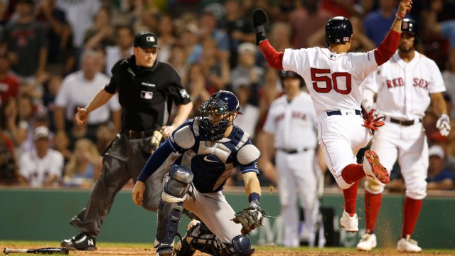 Boston Red Sox right fielder Mookie Betts (50) and Tampa Bay Rays catcher Travis d'Arnaud (37)