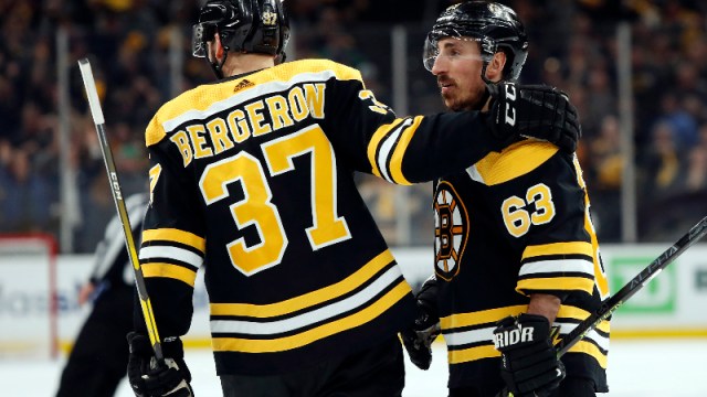 Boston Bruins left wing Brad Marchand (63) and center Patrice Bergeron (37)