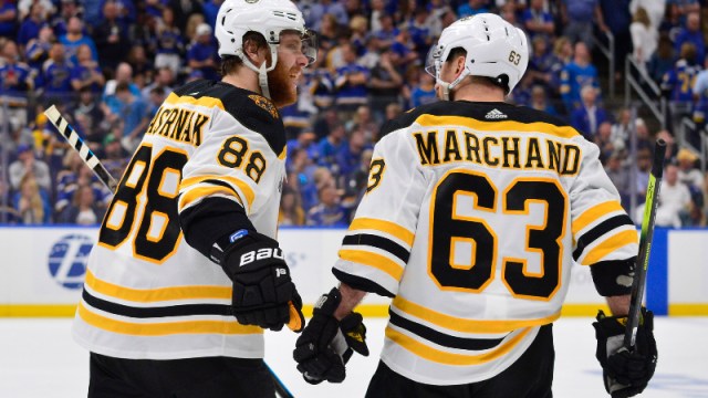 Boston Bruins right wing David Pastrnak (88) and left wing Brad Marchand (63)