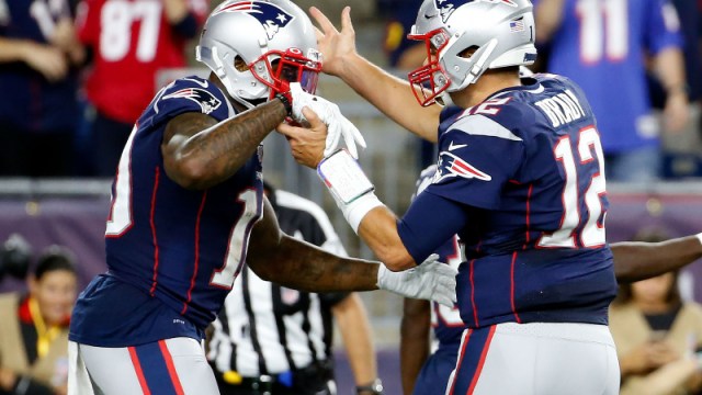 New England Patriots quarterback Tom Brady (12) and wide receiver Josh Gordon (10)