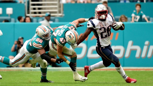 New England Patriots running back Sony Michel (26) and Miami Dolphins outside linebacker Kiko Alonso (47)