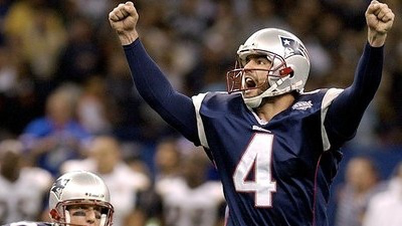 Patriot's kicker Adam Vinatieri (4) celebrates with Ken Walter (13