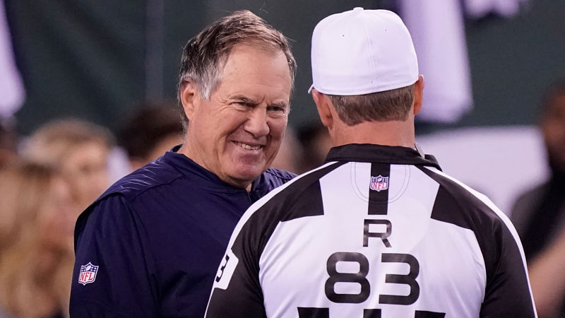 New England Patriots Tom Brady and head coach Bill Belichick smile on the  field during practice before the game against the New York Giants at Giants  Stadium in East Rutherford, New Jersey