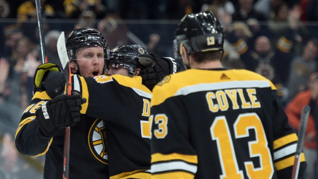 Boston Bruins right wing Brett Ritchie (18), left wing Jake DeBrusk (74) and forward Charlie Coyle (13)